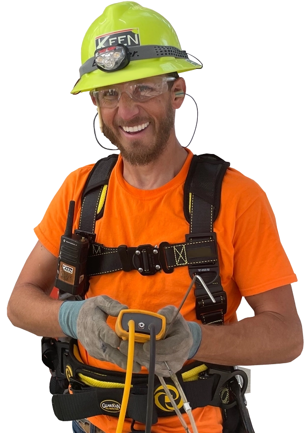 Nick Tiedje cutout in orange shirt, tool harness, and neon green hard hat